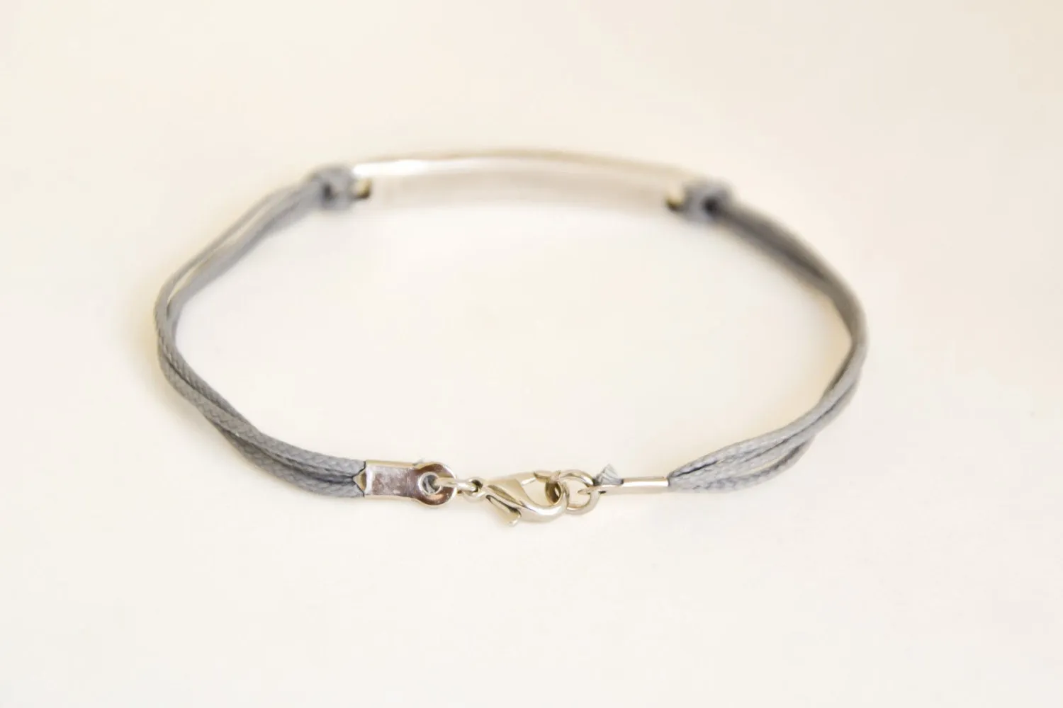 Men's bracelet from Israel with Hebrew sentence: 'God bless you and watch over you' gray cord