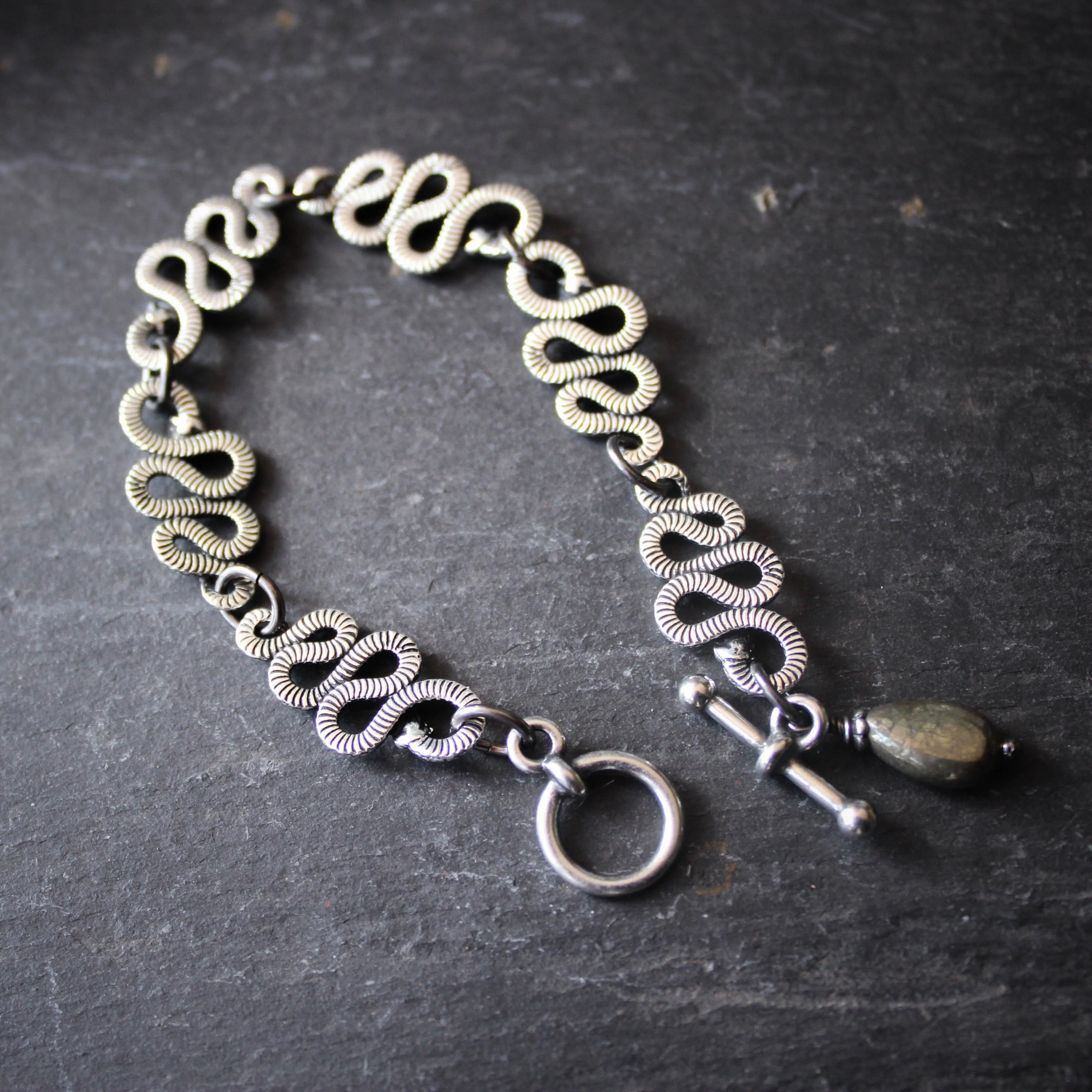 Tangle of Rattlesnakes Bracelet in Silver Plate with Pyrite.